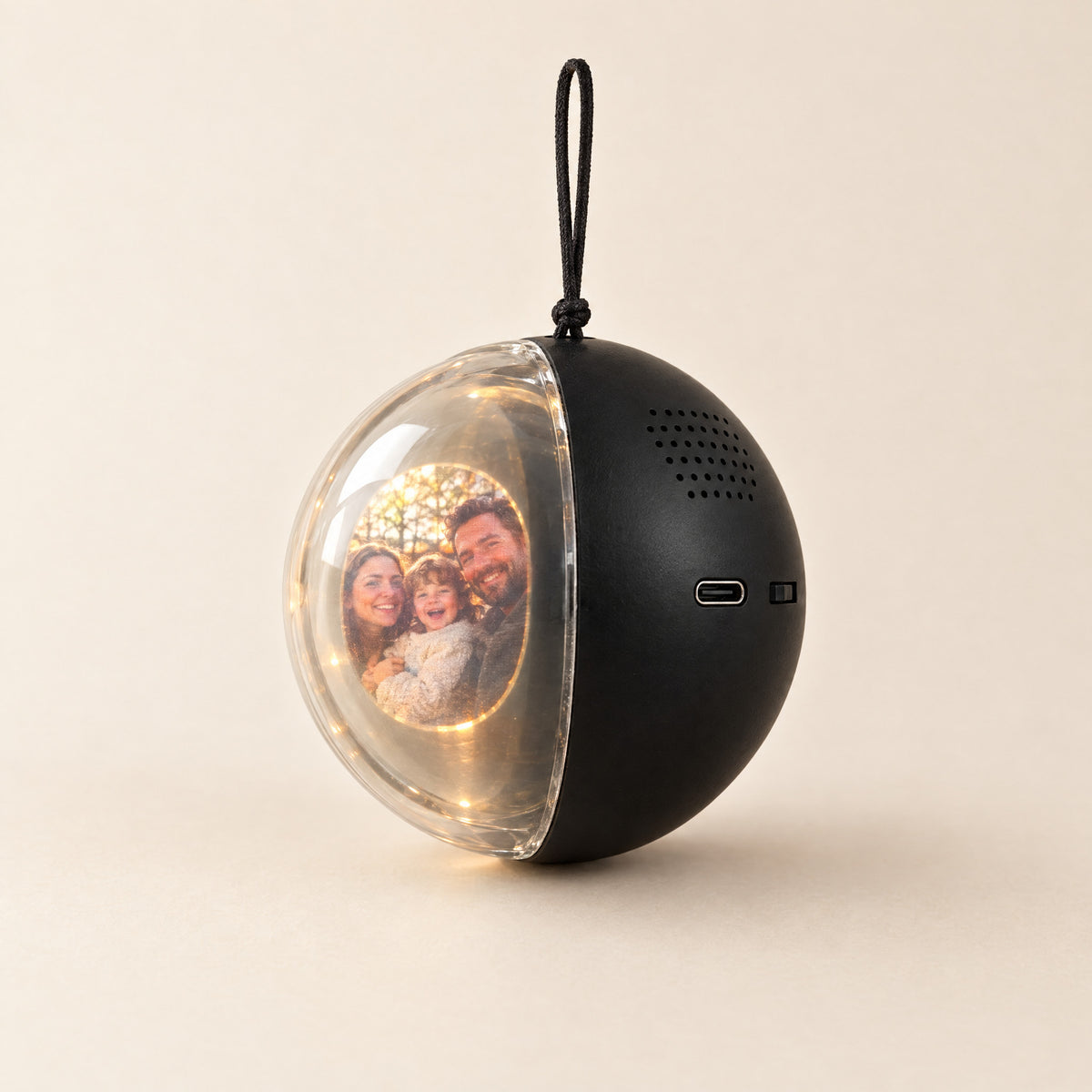 MerryOrb in black, showing a family photo